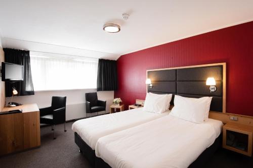 Katil atau katil-katil dalam bilik di Hotel Restaurant Het Witte Huis