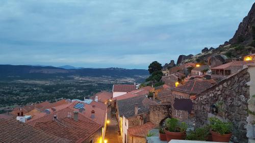 a view of a town with buildings on a hill at CASA DO CASTELLO MONSANTO in Monsanto
