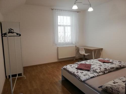 Posteľ alebo postele v izbe v ubytovaní Ubytování v podkroví