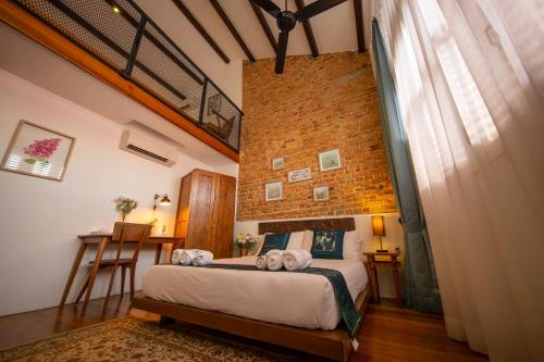 Postel nebo postele na pokoji v ubytování Sweet Cili Boutique Hotel