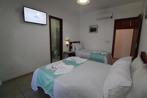 Postel nebo postele na pokoji v ubytování Hotel Pousada 360