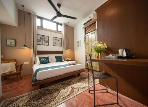 Postel nebo postele na pokoji v ubytování Sweet Cili Boutique Hotel