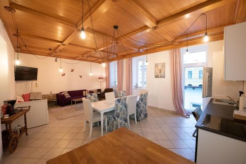 a kitchen and living room with a table and chairs at Ferienwohnung Mariazell - Hulatsch in Mariazell