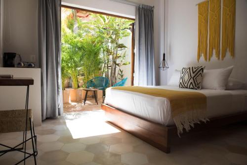מיטה או מיטות בחדר ב-PAL.MAR Hotel Tropical