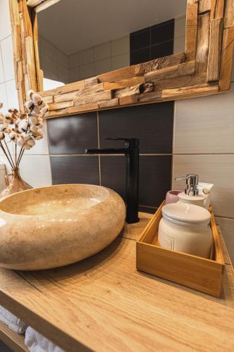 a bathroom with a sink and a toilet on a counter at Zorilor View Apartment in Cluj-Napoca
