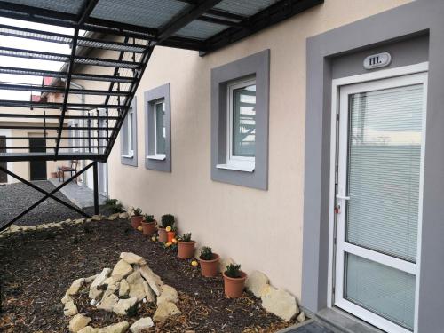 a house with plants on the side of it at Vehlovice Apartments in Mělník