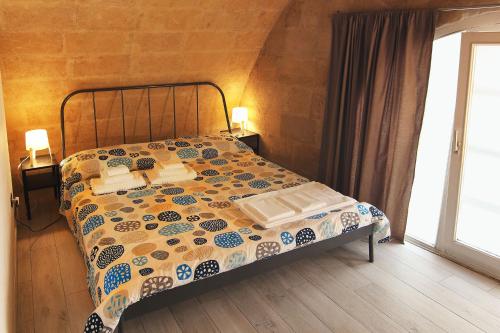 Postel nebo postele na pokoji v ubytování Ostello dei Sassi - Matera Hostels