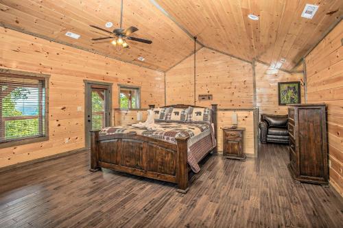 a bedroom with a bed and a ceiling fan at Rainwater Falls in Gatlinburg