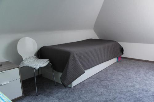 En eller flere senge i et værelse på Ferienresidenz Jägerstieg / FeWo Kruse
