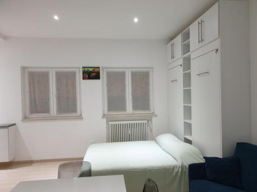 מיטה או מיטות בחדר ב-Blu's Apartment sul Talvera