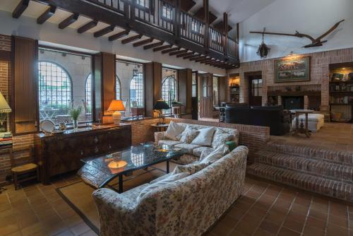 a living room with a couch and a table at Molino De La Vega in Arcos