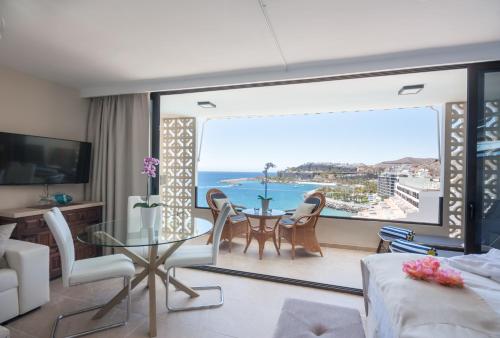 a living room with a view of the ocean at Doñana 1109 in Patalavaca