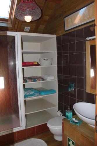 a bathroom with a toilet and a sink at Casa do Mar in Vila Chã