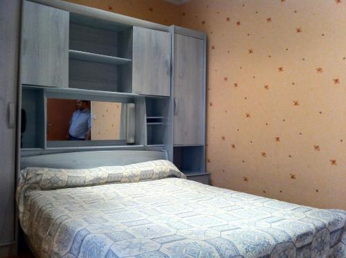 Postel nebo postele na pokoji v ubytování Hotel Des Arts