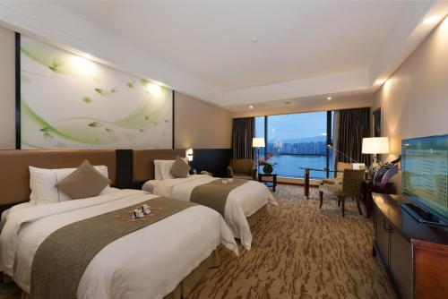 Кровать или кровати в номере KB Hotel Qingyuan