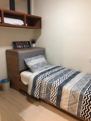 a bedroom with a bed in a room at TimurBay Residence by Onehomes in Kuantan