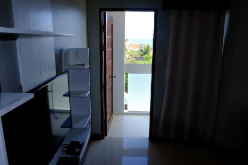 an open door to a room with a door at Pacific Waves Inn (Annex) in Baler