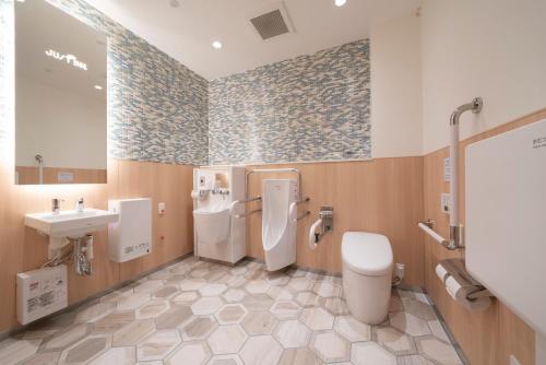 Phòng tắm tại Just Inn Matsusaka Station
