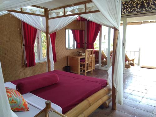 Ένα ή περισσότερα κρεβάτια σε δωμάτιο στο Stairway To Heaven Bungalows and Restaurant