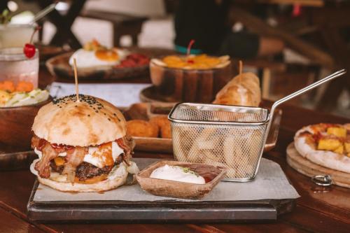 a tray of food with a sandwich on a table at Mad Monkey Hostel Siargao in General Luna