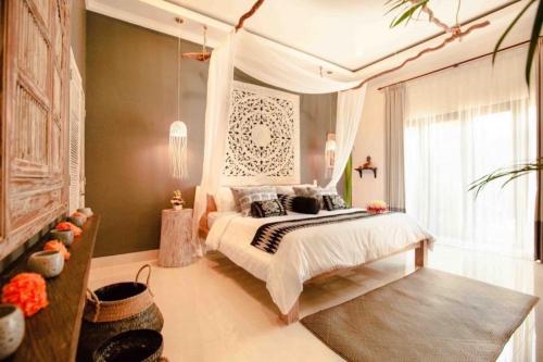 Ліжко або ліжка в номері Villa Sarong 2