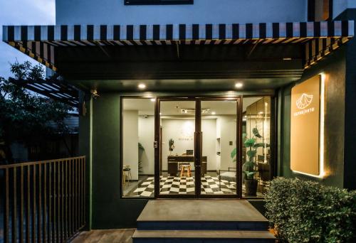 an entrance to a house with glass doors at KLYDE Boutique - Chatuchak in Bangkok