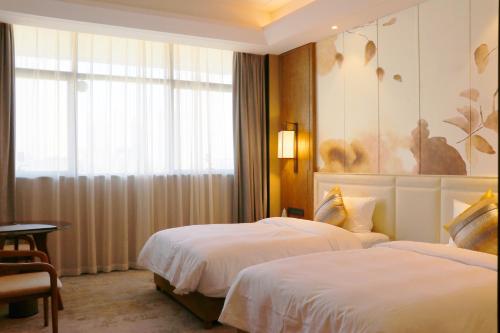 Katil atau katil-katil dalam bilik di Jinling Grand Hotel Nanchang
