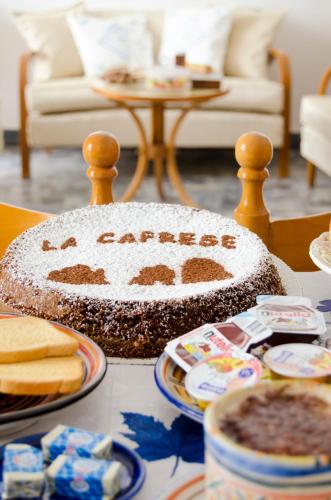 a table topped with a cake with the word cancer at Antico Monastero Di Anacapri in Anacapri