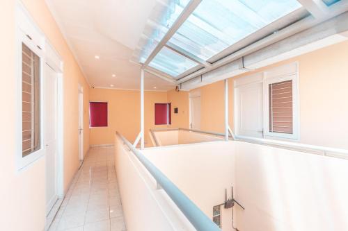 an empty room with a skylight in a building at RedDoorz @ Pavilion Residence Cikarang in Jakarta