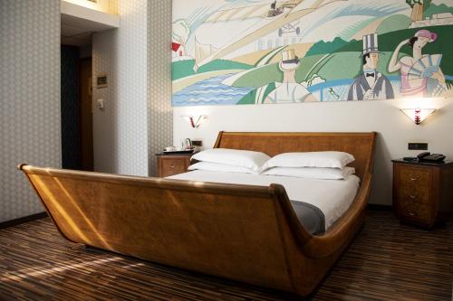 Best Western Hotel Artdeco tesisinde bir odada yatak veya yataklar