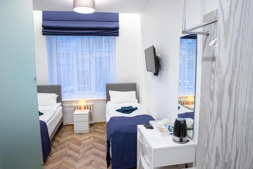 Säng eller sängar i ett rum på Hot Spot Vilnius Apartments