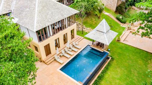 an aerial view of a house with a swimming pool at Pawanthorn Samui - SHA Plus in Chaweng