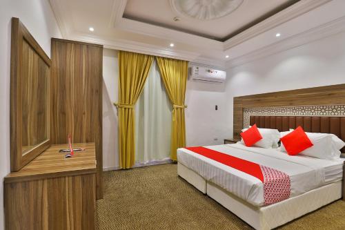 Krevet ili kreveti u jedinici u objektu Qasr Al Hamra ApartHotel Al Hamra Branch