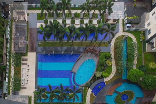 an overhead view of a swimming pool at a resort at CASAMIA Colombo @ On Three20 in Colombo