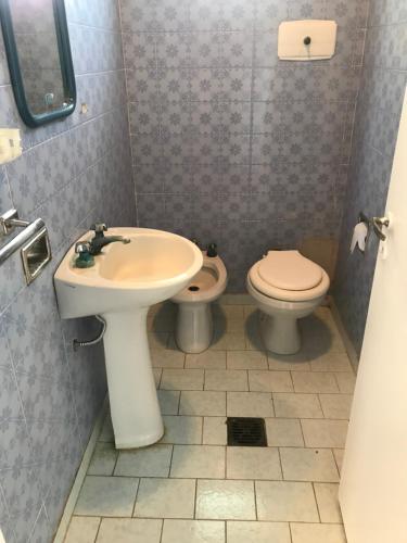 a bathroom with a sink and a toilet at La Soñada in Lobos