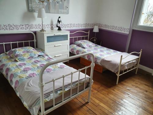 Ein Bett oder Betten in einem Zimmer der Unterkunft Libération-Maison d'hotes