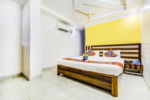 a bedroom with a large bed in a room at FabHotel Grand Sheela in Patna