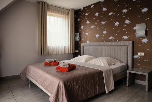 Een bed of bedden in een kamer bij B&B Relais du Vigneron - Jean-Luc et Bruno Meyer