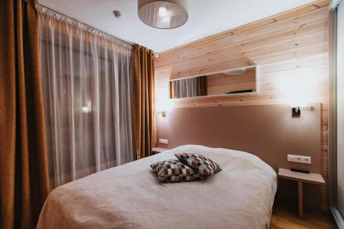 Säng eller sängar i ett rum på Baza Otdyha Lesnaya