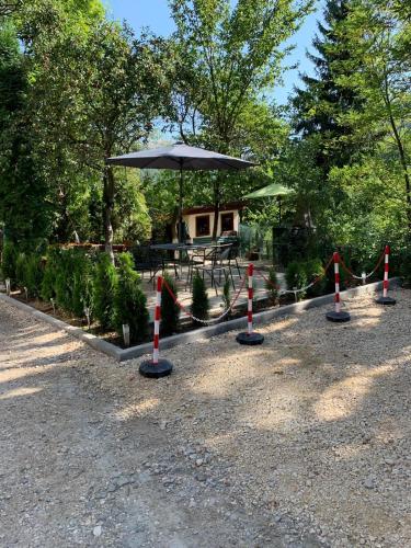 a group of orange and white poles with an umbrella at Residence SINAIA Apartments in Sinaia