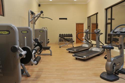 a gym with several treadmills and cardio machines at Premier Hotel The Richards in Richards Bay