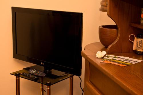 a flat screen tv sitting on top of a table at Umbria Weekend in Cascia