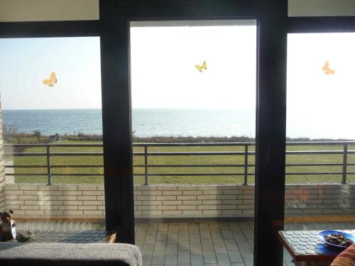a view of the ocean from a room with windows at STHS79125-FeWo-Oostseebreker in Staberdorf