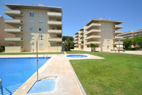 a swimming pool in front of a apartment building at WVP - Aqua I in Salou