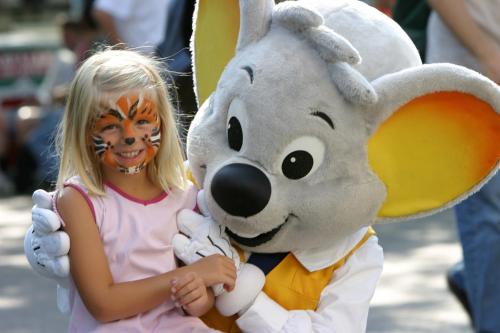a little girl with her face painted next to a bunny mascot at Villa Scandic Apartments in Rust