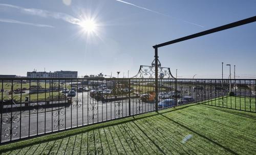 a balcony with a view of a parking lot at Fabrik Apartments - Harrowside by Blackpool Service Apartements in Blackpool