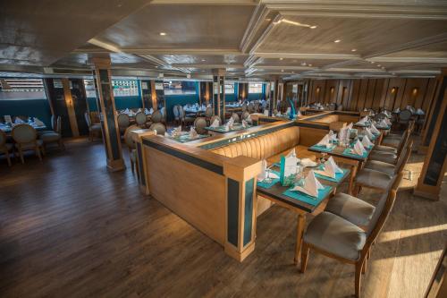 an overhead view of a restaurant with tables and chairs at SUNRISE Semiramis II Cruise in Luxor