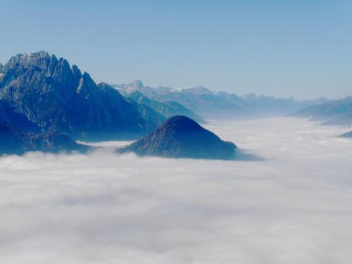 a mountain range above a layer of clouds at Ferienhaus Sporer in Iselsberg