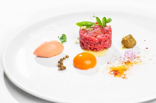 a plate of food on a white plate at Steinegger Eppan in Appiano sulla Strada del Vino