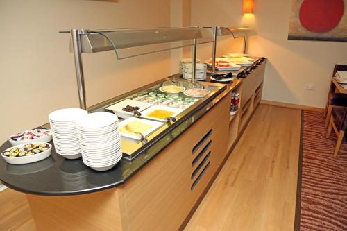 a buffet line in a hotel room with food at Shore View Hotel in Eastbourne